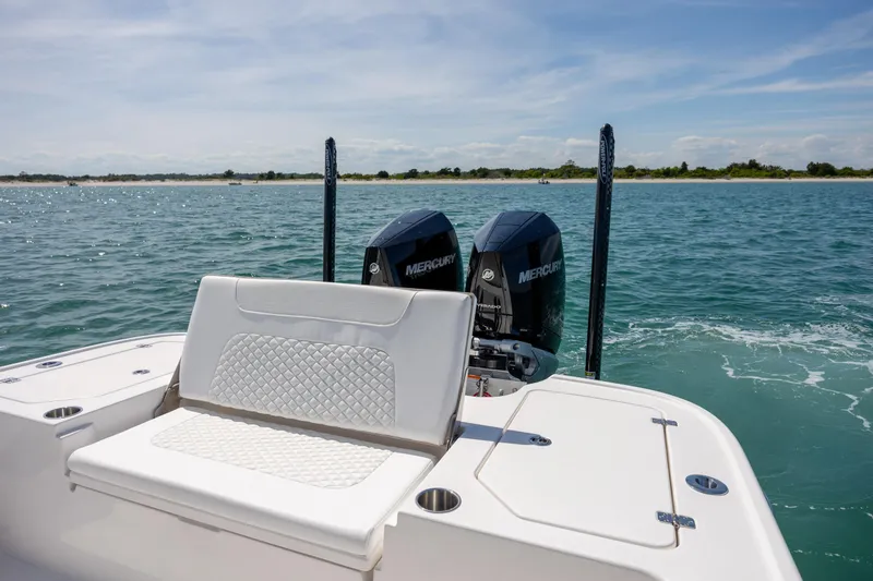 Slide: The Image of 2026 Caymas 281 HB boat with dual Mercury engines on open water. - 28