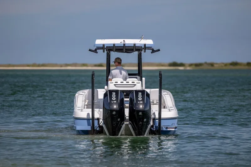 Slide: The Image of 2026 Caymas 281 HB boat with dual engines on open water. - 3