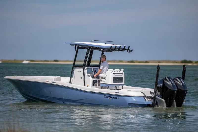 Slide: The Image of 2026 Caymas 281 HB boat cruising on open water with dual Mercury engines. - 4