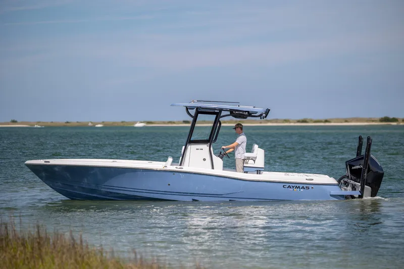 Slide: The Image of 2026 Caymas 281 HB boat cruising on calm waters with a clear sky backdrop. - 5