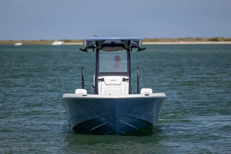 Slide: The Image of 2026 Caymas 281 HB boat cruising on open water, front view. - 8