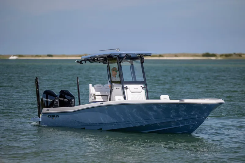 Slide: The Image of 2026 Caymas 281 HB boat on calm water, featuring dual Mercury engines. - 9