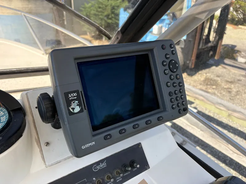Slide: The Image of Garmin GPS on 1996 Carolina Classic 25 Express boat. - 17
