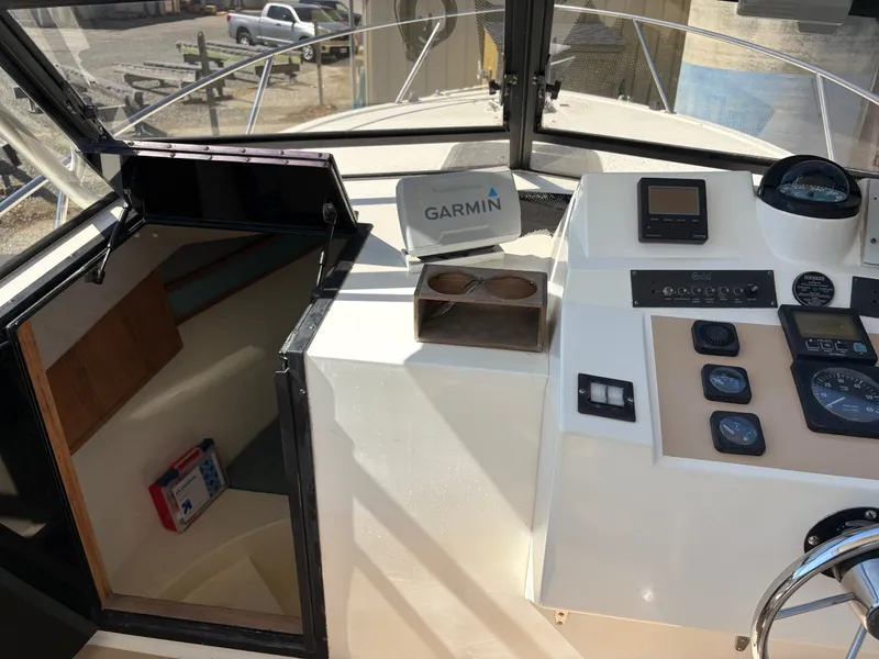 Slide: The Image of Interior view of a 1996 Carolina Classic 25 Express boat. - 21