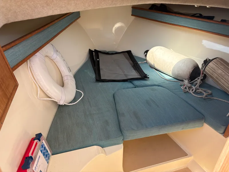 Slide: The Image of Interior of a 1996 Carolina Classic 25 Express boat with life ring. - 22