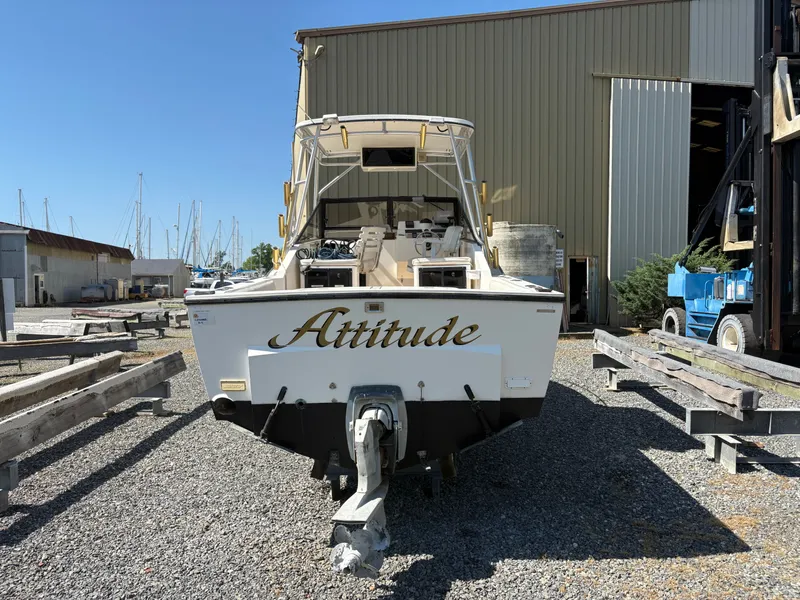 Slide: The Image of 1996 Carolina Classic 25 Express boat in harbor. - 4