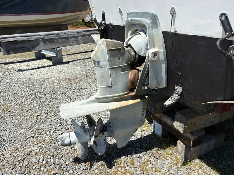 Slide: The Image of Outboard motor of a 1996 Carolina Classic 25 Express boat. - 7