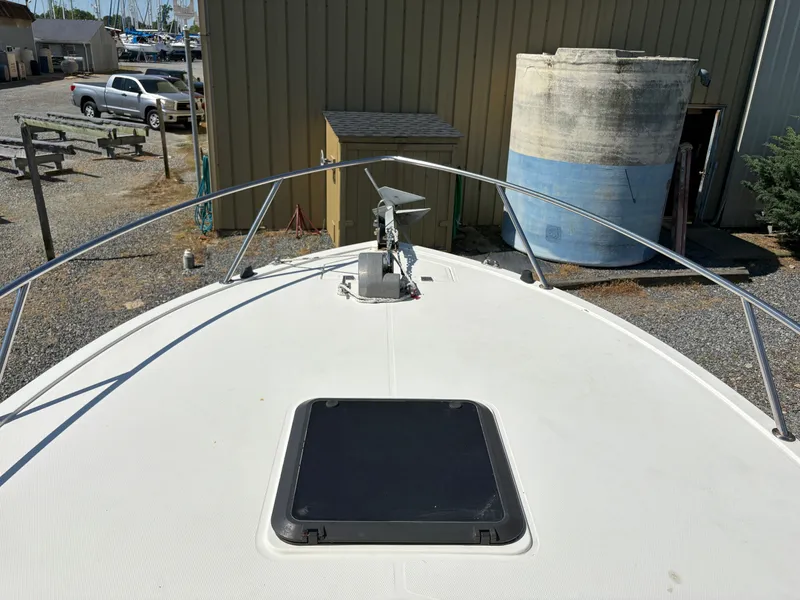 Slide: The Image of Foredeck of a 1996 Carolina Classic 25 Express boat in a marina. - 8