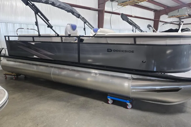 The Image of 2026 Dockside 22DQ275 pontoon boat in a showroom, featuring sleek design and modern amenities. - 1