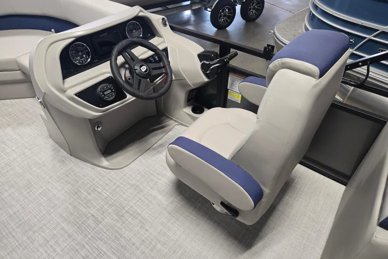 Slide: The Image of Interior of 2026 Dockside 22DQ275 boat, featuring modern steering console and comfortable seating. - 10