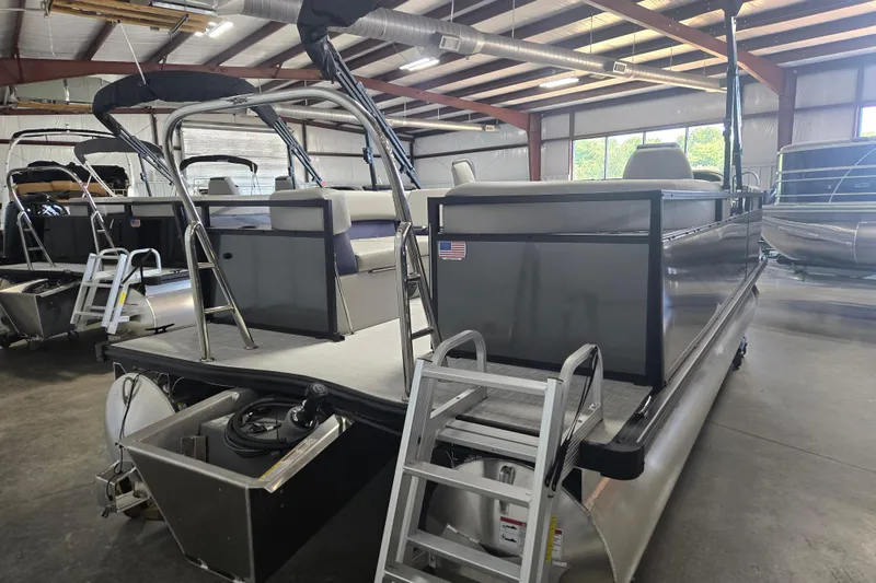 Slide: The Image of 2026 Dockside 22DQ275 pontoon boat in showroom, featuring sleek design and modern amenities. - 4