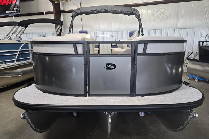 Slide: The Image of 2026 Dockside 22DQ275 pontoon boat in showroom, featuring sleek design and modern seating. - 5