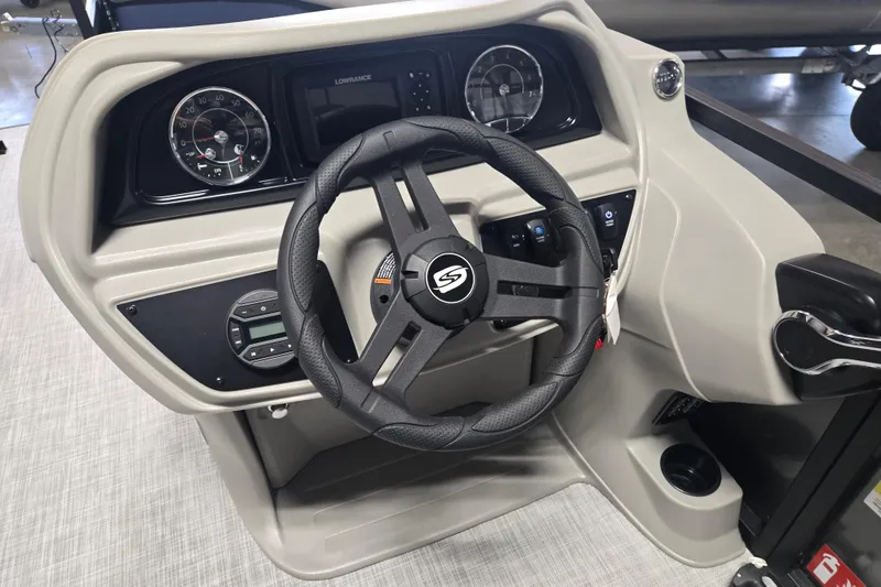 Slide: The Image of Steering console of 2026 Dockside 22DQ275 boat with modern controls and gauges. - 9
