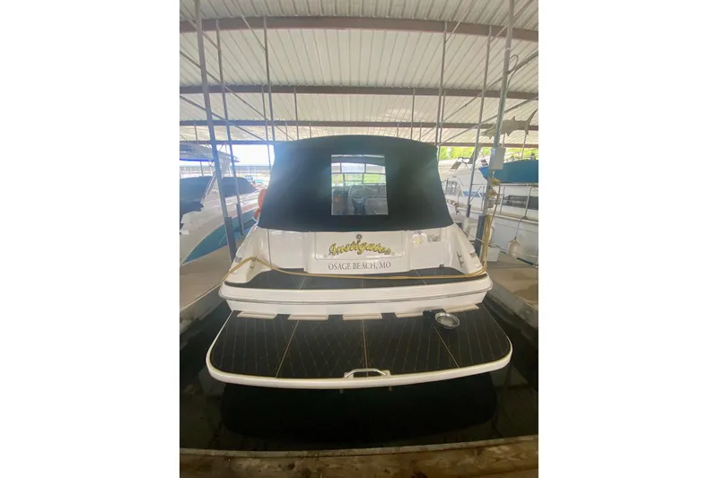 Slide: The Image of 1995 Sea Ray Sundancer 370 docked, rear view with black canopy, Osage Beach, MO. - 1