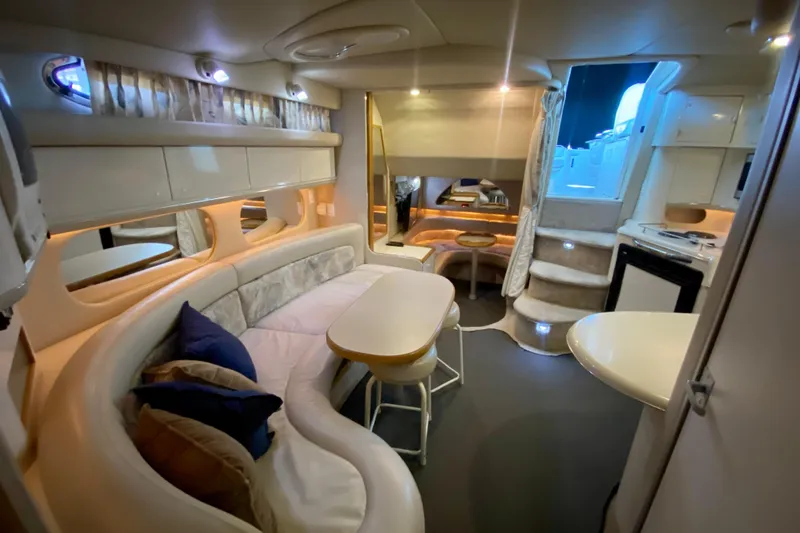 Slide: The Image of Luxurious interior of a 1995 Sea Ray Sundancer 370 yacht with elegant seating and modern amenities. - 18