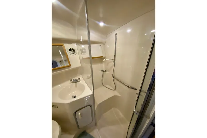 Slide: The Image of Bathroom interior of 1995 Sea Ray Sundancer 370 yacht, featuring sink and shower. - 20