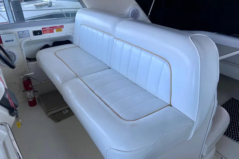 Slide: The Image of White leather seating on a 1995 Sea Ray Sundancer 370 boat interior. - 9
