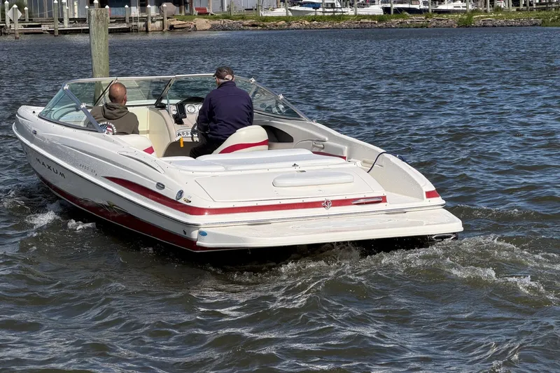 Slide: The Image of 2004 Maxum 2200 SR3 boat cruising on a sunny day. - 1