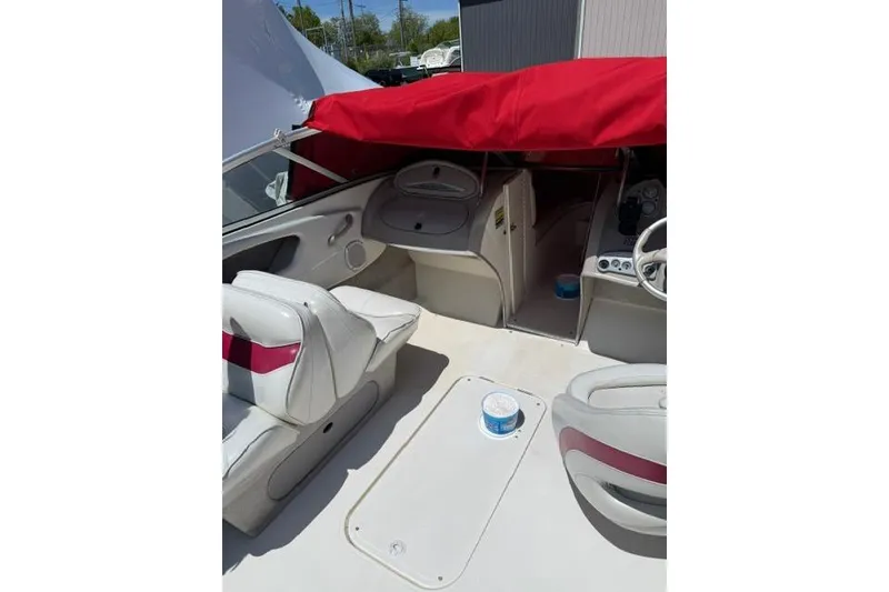 Slide: The Image of 2004 Maxum 2200 SR3 boat interior with red canopy and white seating. - 5