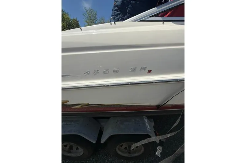 Slide: The Image of 2004 Maxum 2200 SR3 boat side view with model name visible. - 6