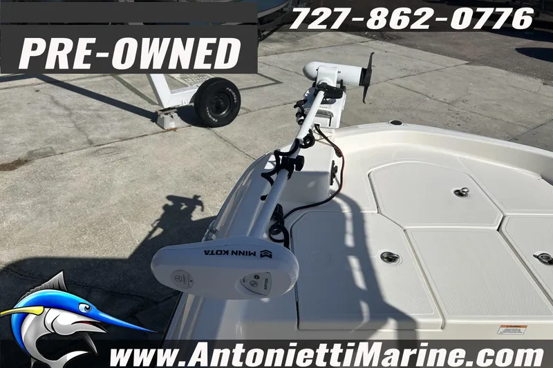 Slide: The Image of Pre-owned 2022 Bayliner Trophy T18Bay boat with Minn Kota trolling motor, available at Antonietti Marine. - 18