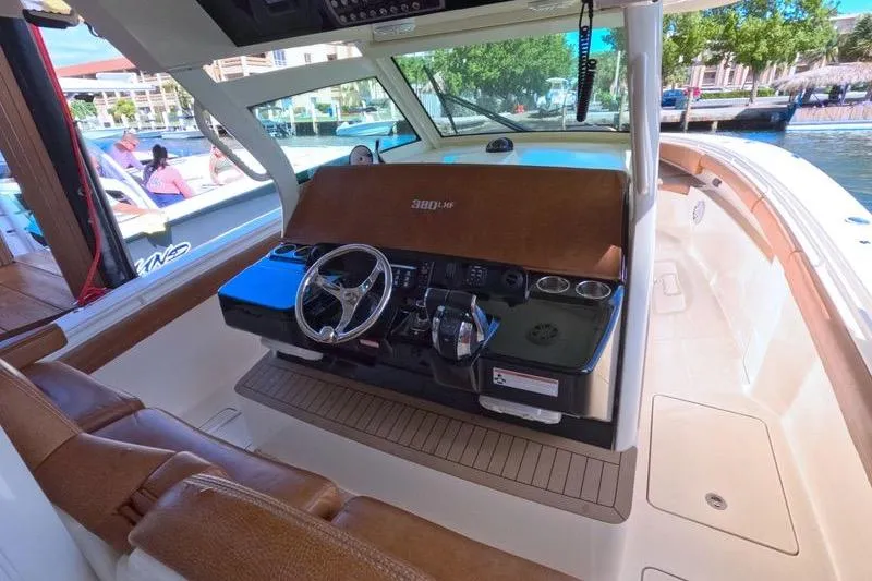 Slide: The Image of 2018 Scout 380 LXF boat interior with steering wheel and control panel. - 7