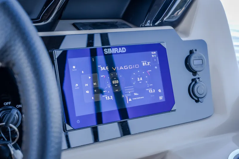 Slide: The Image of Simrad display on 2026 Viaggio Z24S boat dashboard, showing navigation and system controls. - 42