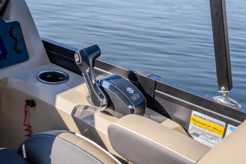 Slide: The Image of Control panel of 2026 Viaggio Z24S boat with throttle lever and cup holder. - 41