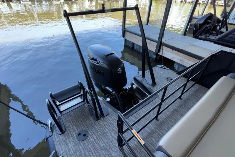 Slide: The Image of Pontoon boat Viaggio Z24U 2026 with Suzuki outboard motor at dockside. - 25