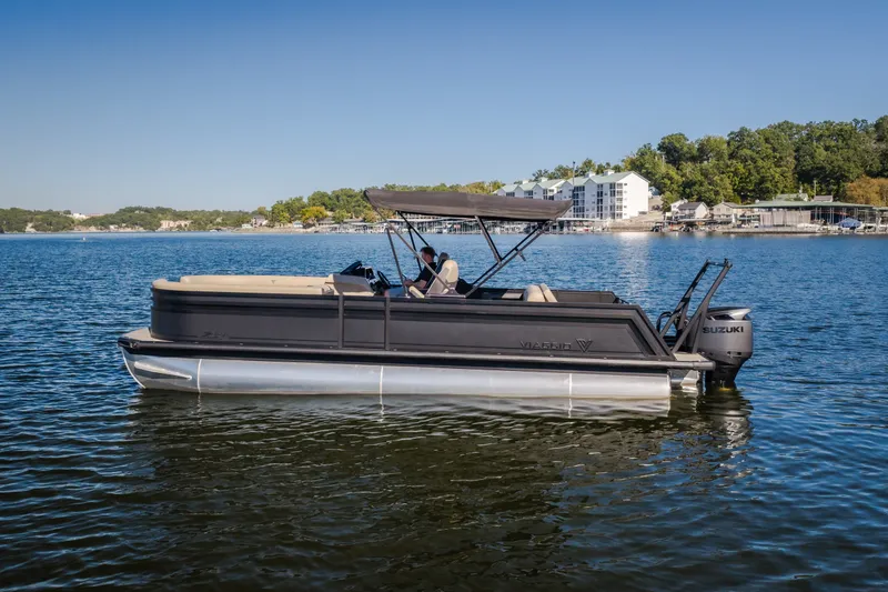 Slide: The Image of 2026 Viaggio Z24S pontoon boat on a serene lake with scenic background. - 48