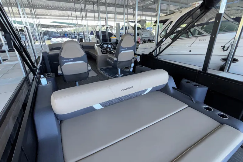 Slide: The Image of Interior of 2026 Viaggio Z24U boat with beige seating and modern dashboard. - 29