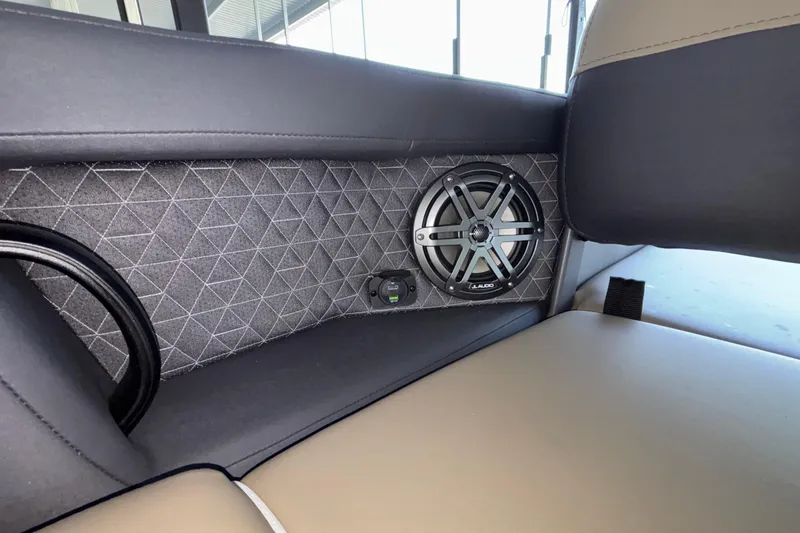 Slide: The Image of Interior of 2026 Viaggio Z24U featuring a stylish speaker and quilted panel design. - 37