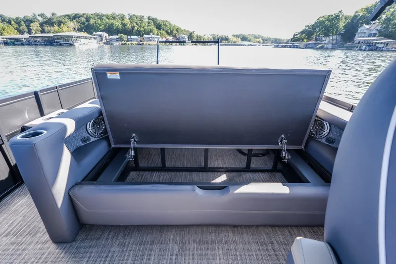 Slide: The Image of 2026 Viaggio Z24S boat interior with open storage compartment on a lake. - 44