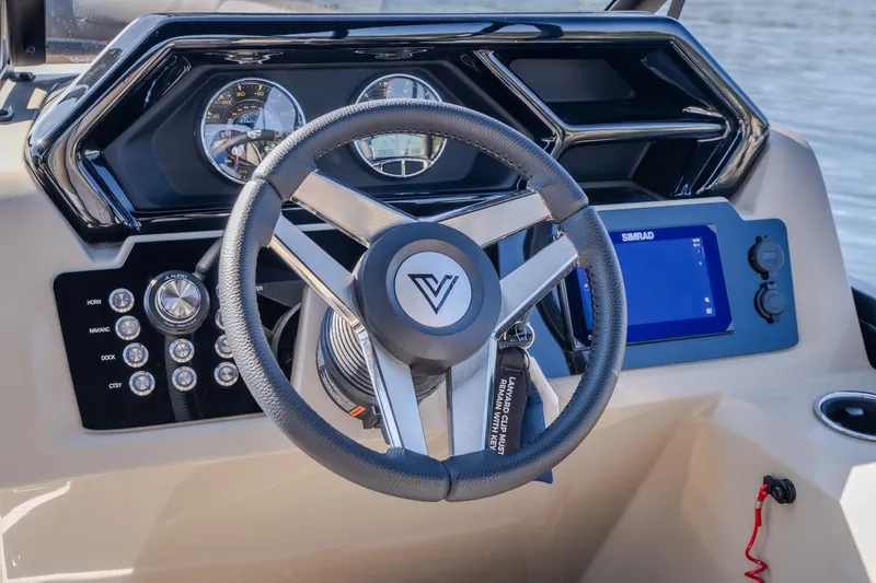 Slide: The Image of Steering wheel and dashboard of 2026 Viaggio Z24S boat with navigation controls. - 40