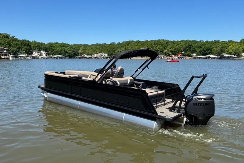 Slide: The Image of 2026 Viaggio Z24U pontoon boat on a lake with Suzuki outboard motor. - 5