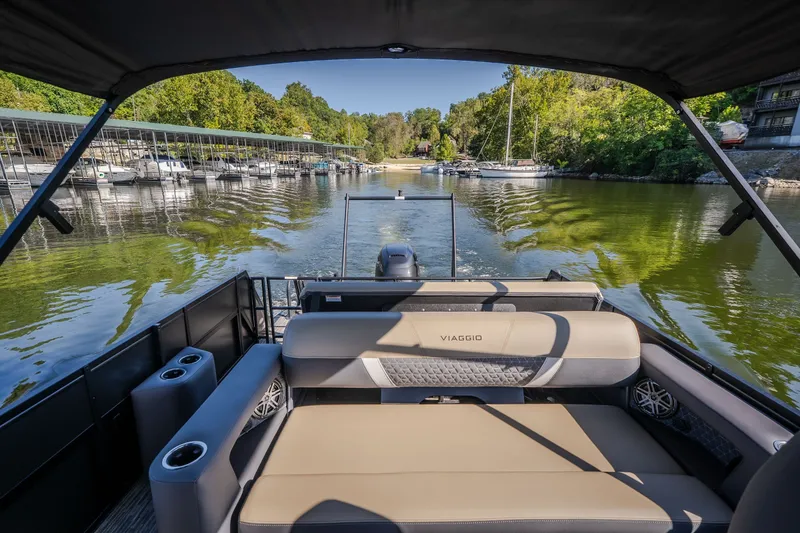 Slide: The Image of 2026 Viaggio Z24S boat cruising on a scenic lake with lush greenery. - 37
