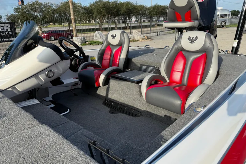Slide: The Image of 2019 Phoenix 819 Pro boat interior with red and gray seats, steering console visible. - 13
