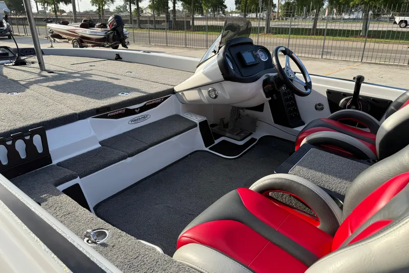 Slide: The Image of Interior of a 2019 Phoenix 819 Pro boat with red and gray seating. - 15