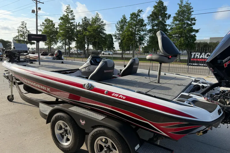 Slide: The Image of 2019 Phoenix 819 Pro fishing boat on trailer, featuring sleek design and modern equipment. - 3