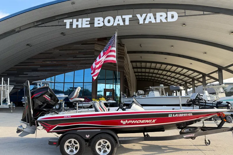 Slide: The Image of 2019 Phoenix 819 Pro boat at The Boat Yard with American flag. - 4