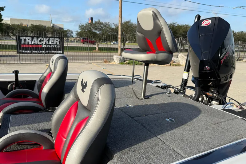 Slide: The Image of 2019 Phoenix 819 Pro boat with red and gray seating, featuring a powerful outboard motor. - 7