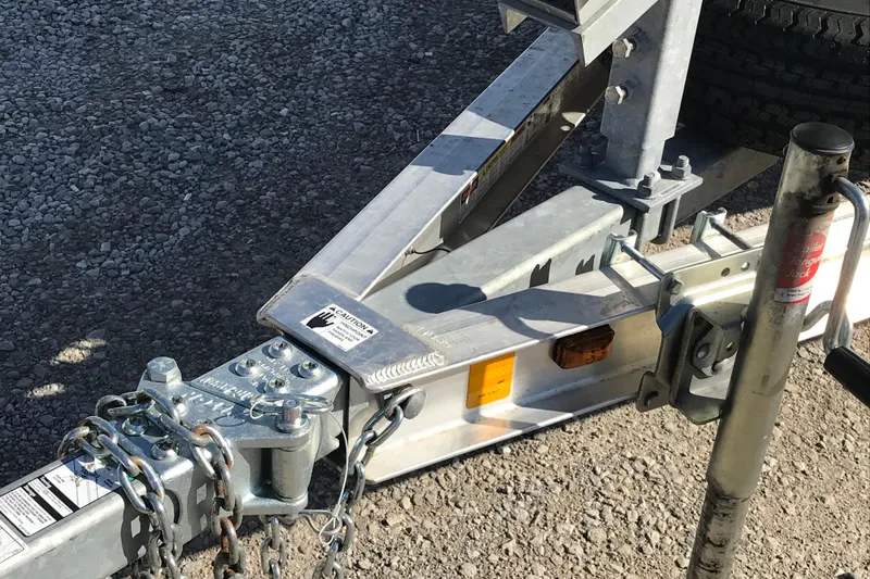 Slide: The Image of Trailer hitch of a 2015 War Eagle 961 Blackhawk on gravel surface. - 10