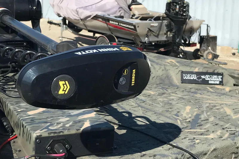Slide: The Image of Minn Kota Terrova motor on 2015 War Eagle 961 Blackhawk boat, camo design. - 11