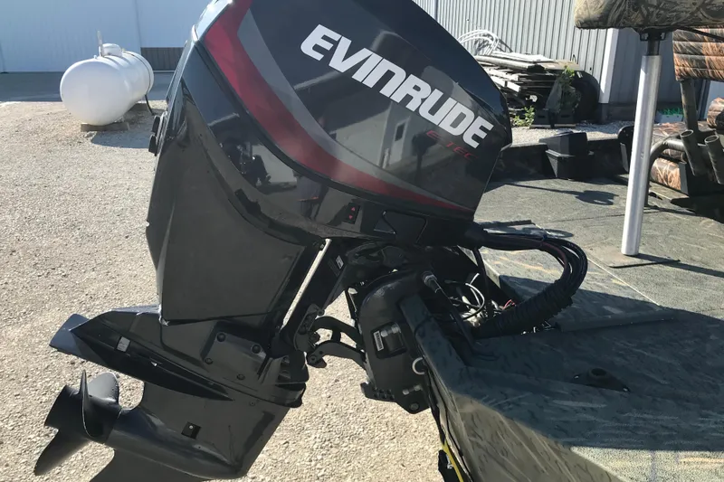 Slide: The Image of 2015 War Eagle 961 Blackhawk with Evinrude outboard motor in a sunny outdoor setting. - 3