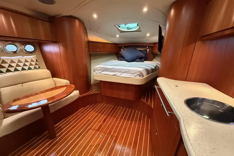 Slide: The Image of Luxurious interior of 2008 Tiara Yachts 3500 Sovran with wood finish and cozy seating. - 17
