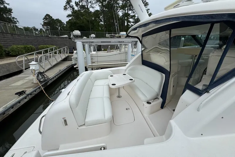 Slide: The Image of 2008 Tiara Yachts 3500 Sovran at dock, featuring spacious seating and sleek design. - 8