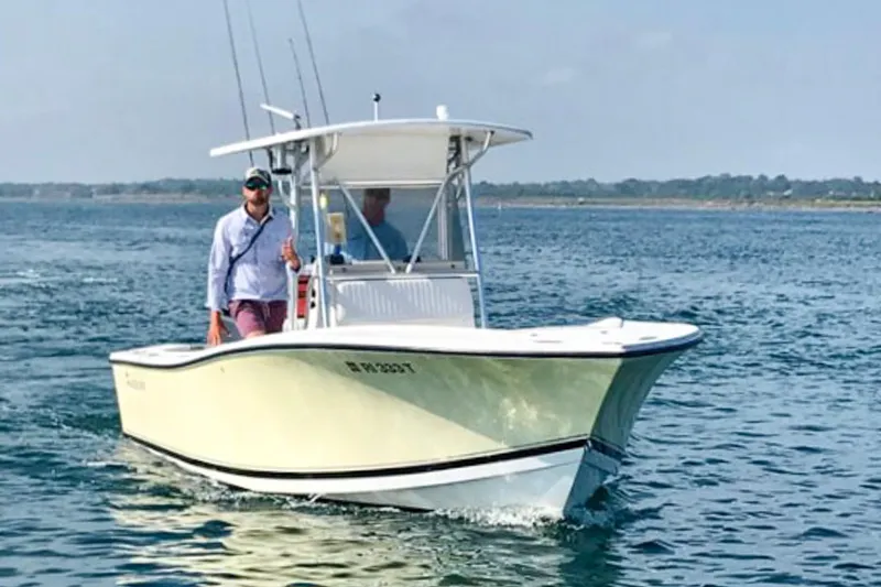 The Image of 2002 Regulator 23 Center Console boat cruising on open water. - 1