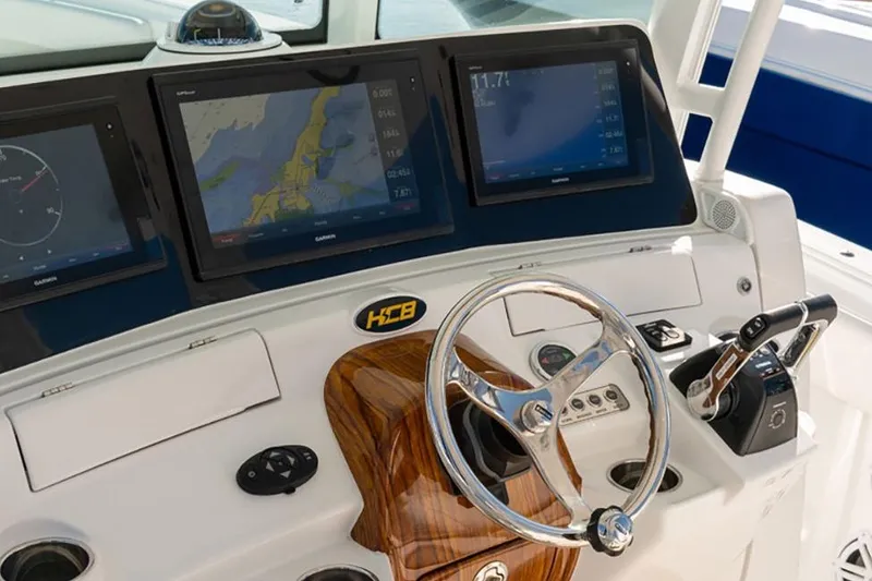 Slide: The Image of Manufacturer Provided Image: HCB Speciale 2020 boat dashboard with navigation screens and steering wheel. - 1