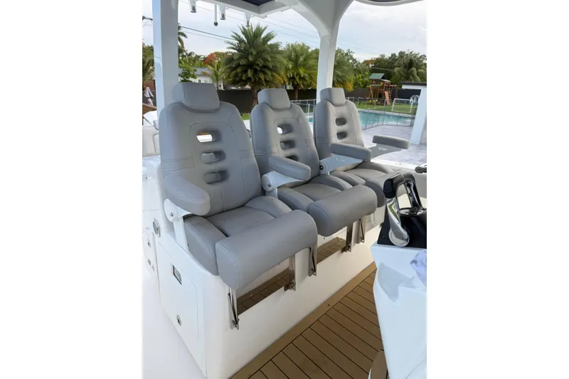 Slide: The Image of Luxury seating on 2020 HCB 39 Speciale boat, featuring sleek gray upholstery. - 10