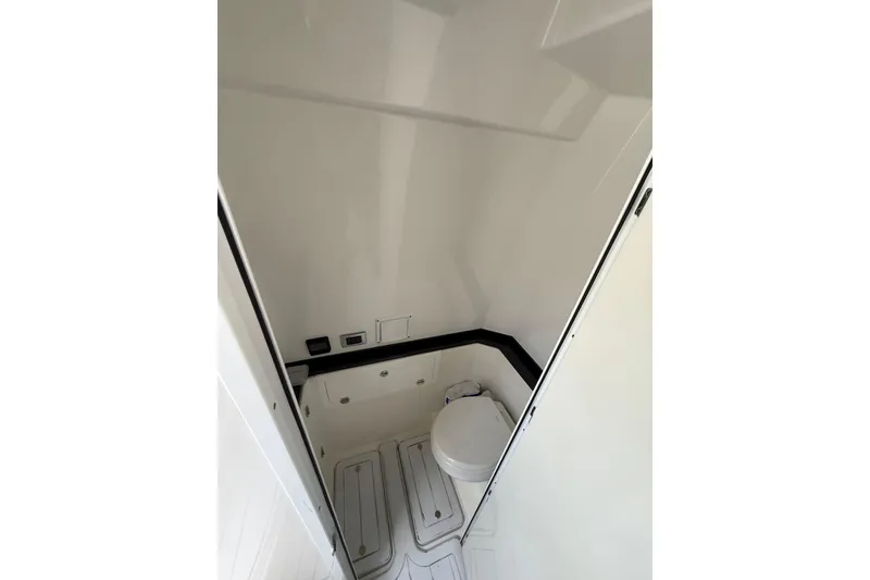 Slide: The Image of 2020 HCB 39 Speciale boat interior bathroom with compact toilet design. - 11